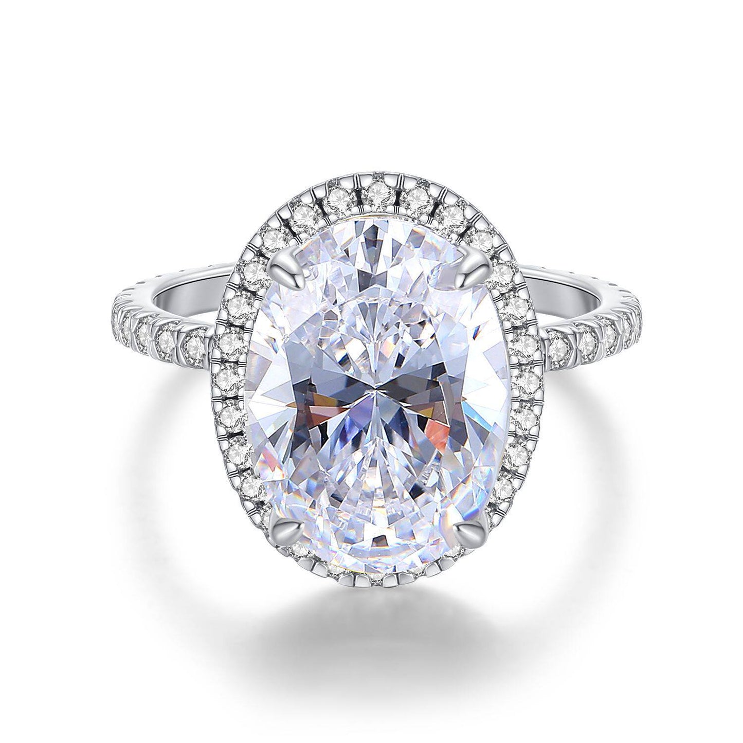 Diamond ring with a large central gemstone and smaller stones around on a white background