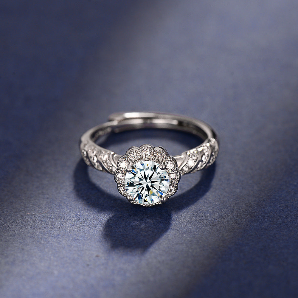 Silver ring with a diamond on a dark blue background