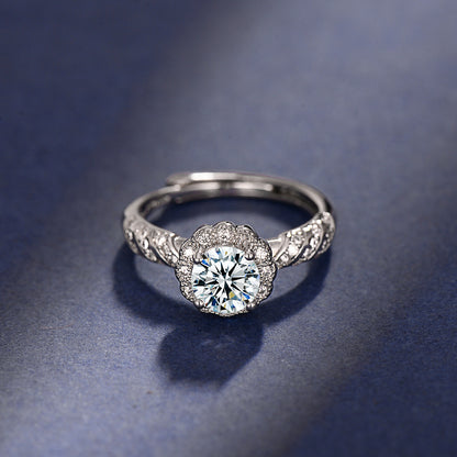 Silver ring with a diamond on a dark blue background