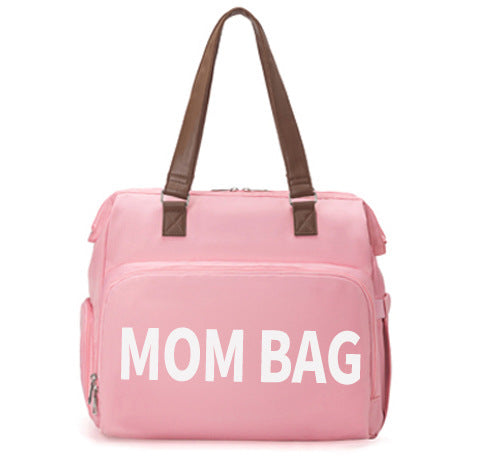 Pink bag labeled 'Mom Bag' with brown handles on a white background