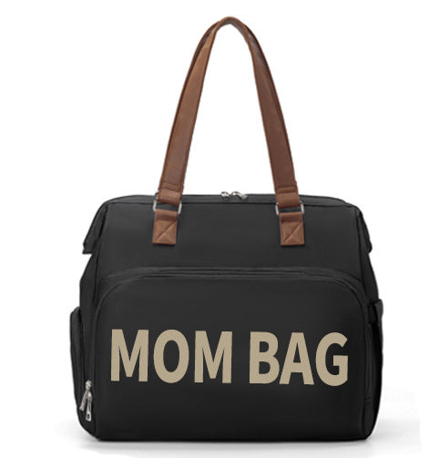 Black bag with 'Mom Bag' text and brown handles on a white background