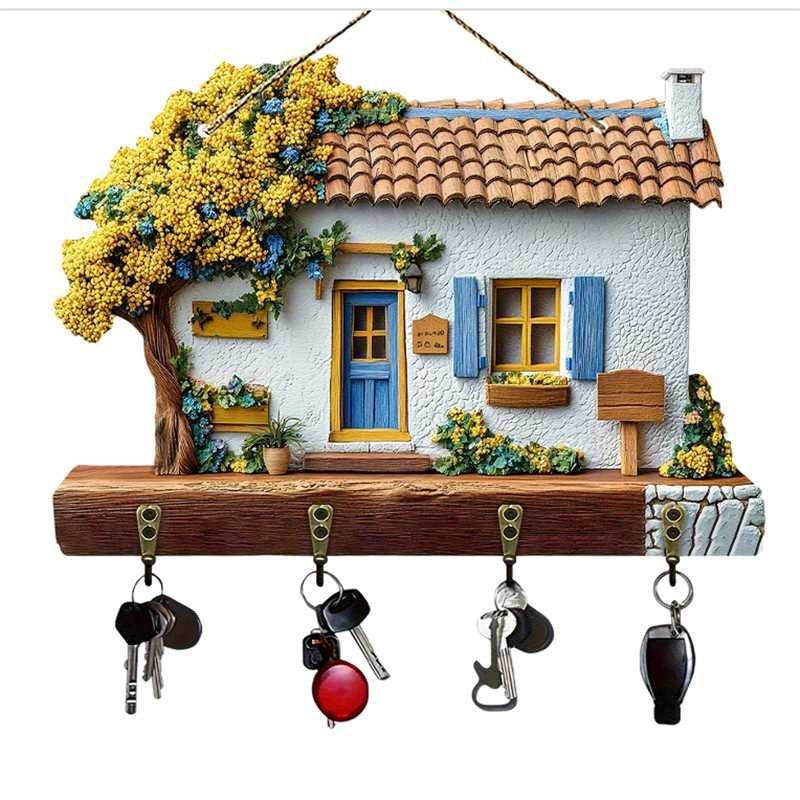 Decorative key holder shaped like a house with keys hanging on it
