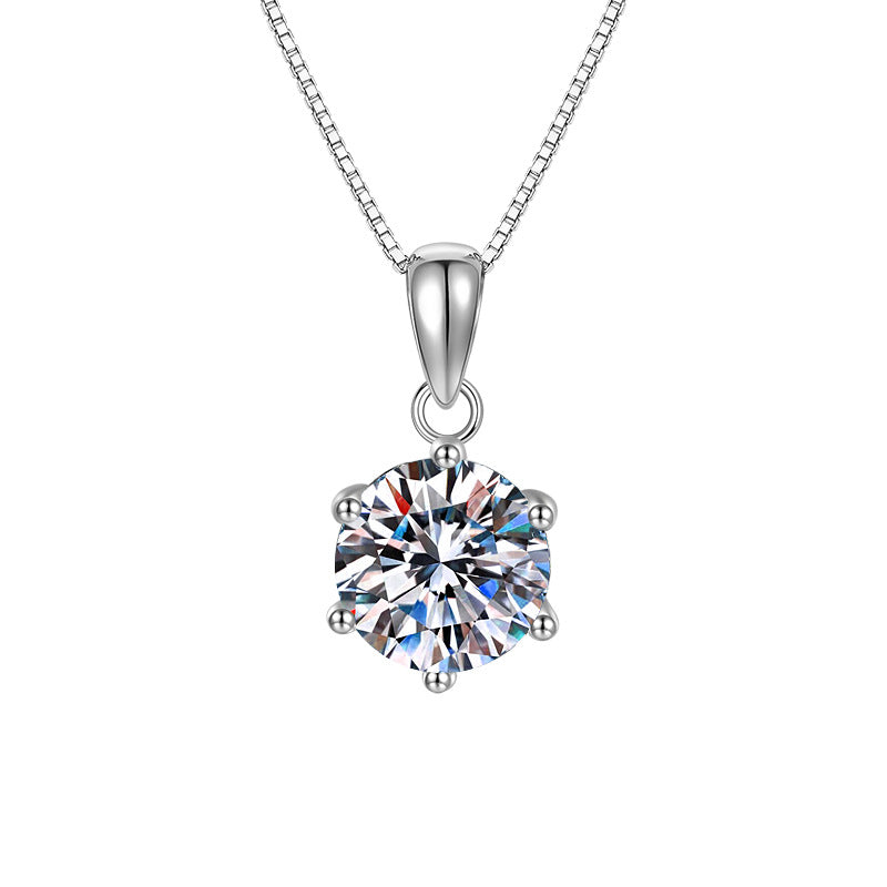 Silver necklace with a large diamond pendant on a white background