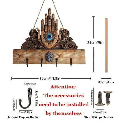 Decorative wall hook with hand design and measurements on a white background